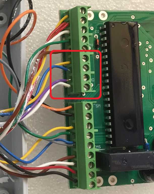 The 4 IR sensor screw terminals on the PCB, circled in red