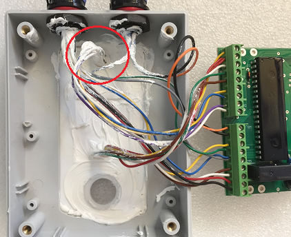 Inside of the CloudWatcher cover, IR sensor wires circled in red among the other sensor wires