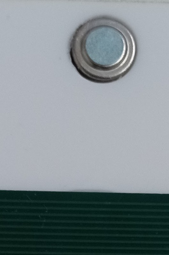 The IR sensor covered with a small round sticker