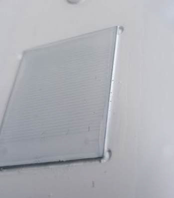 The rain sensor fully covered with a thin, even white layer of Plastidip