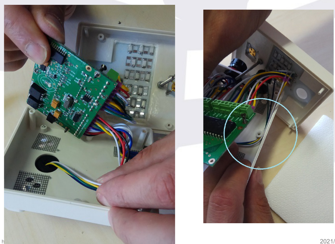 Wires guided along the right side of the box, hooked to a small tab, with the hooked area circled
