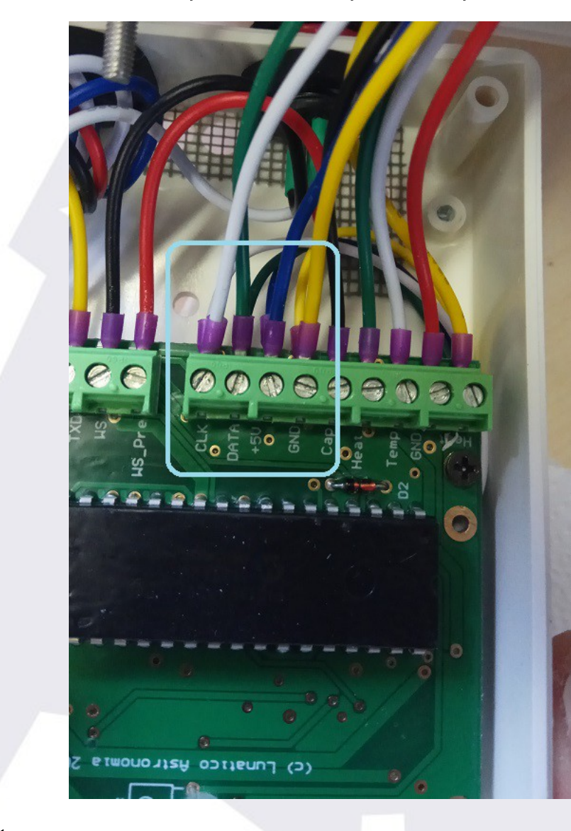 Pulling gently on each wire to confirm it is firmly attached to the board